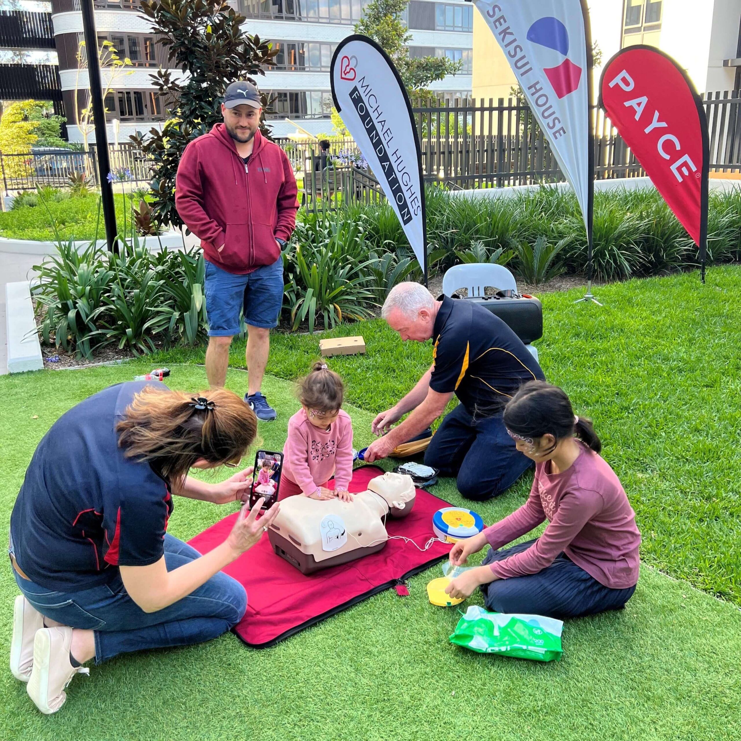General Manager, Julie Hughes and HOTN Trainer teaches 2-year old how to conduct CPR.
