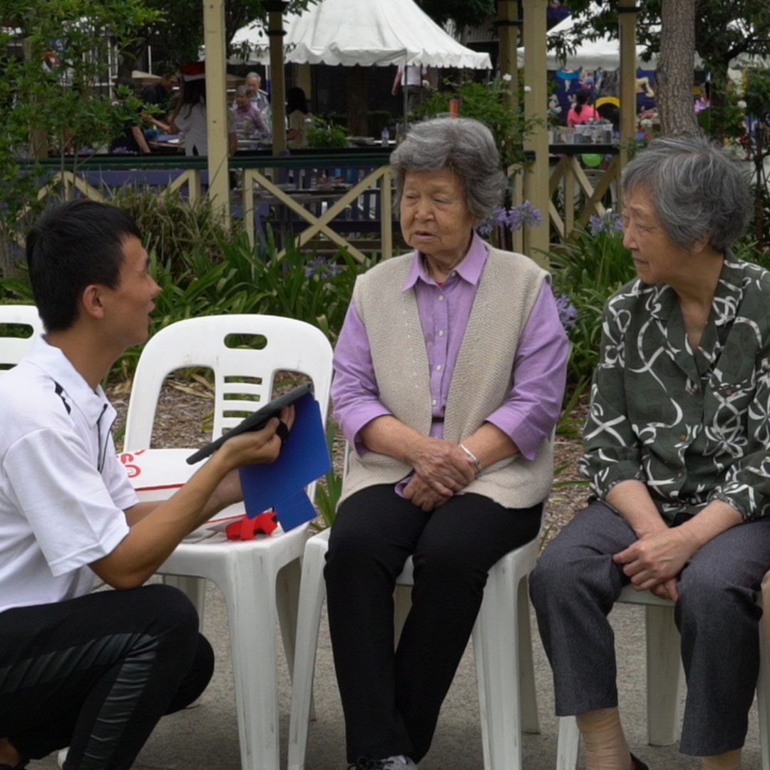 BROOKS Community Engagement Facilitator conducting Stakeholder Survey with local resident.